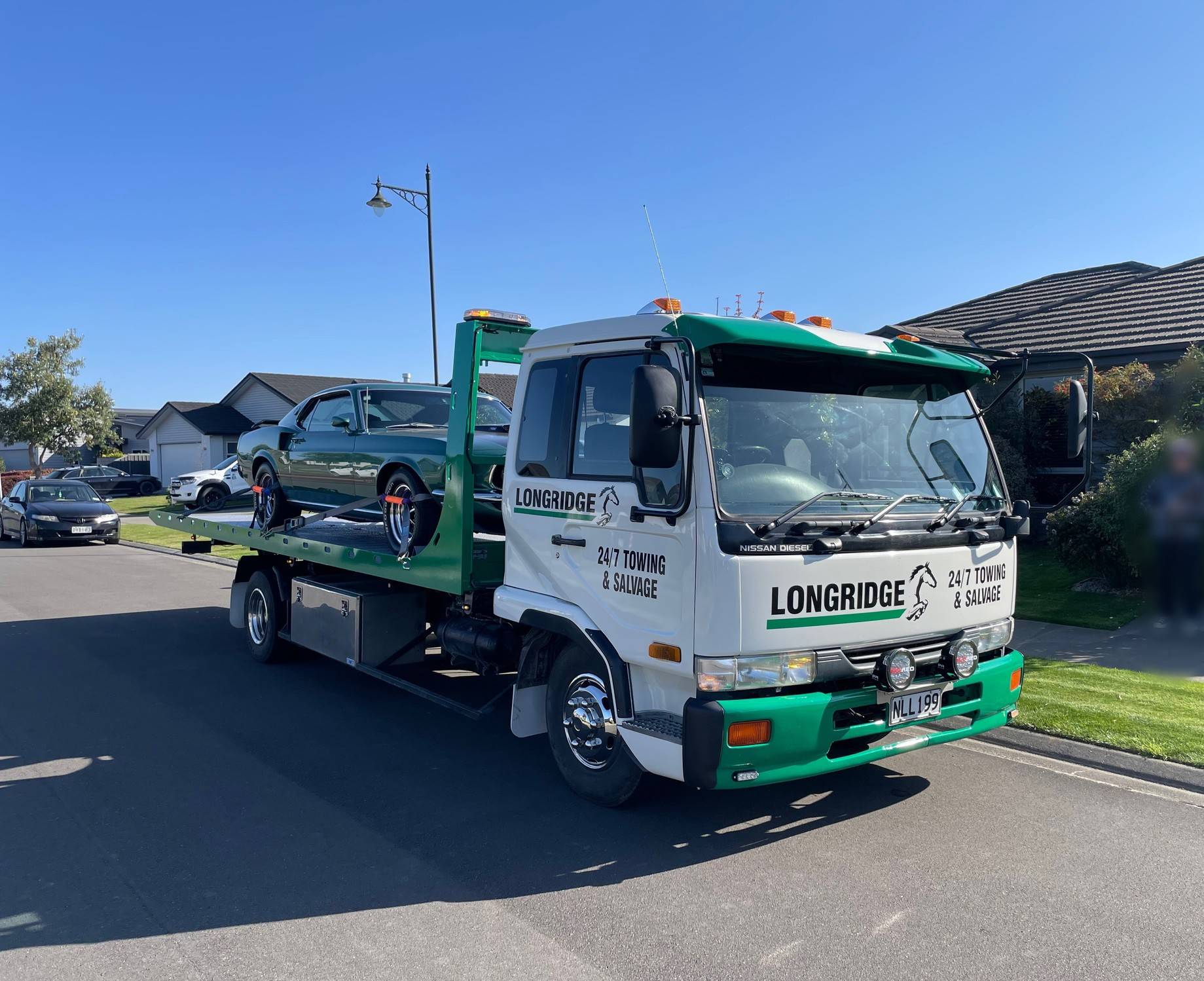  24-Hour Towing & Salvage services available, including roadside assistance, damaged vehicle recovery, secure storage